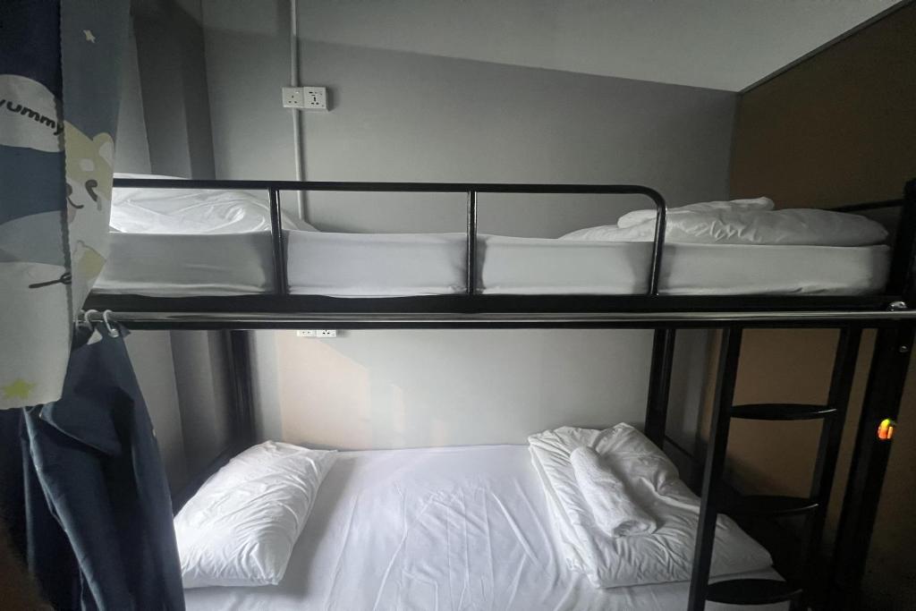 Postel nebo postele na pokoji v ubytování Makotel Hostel Ipoh