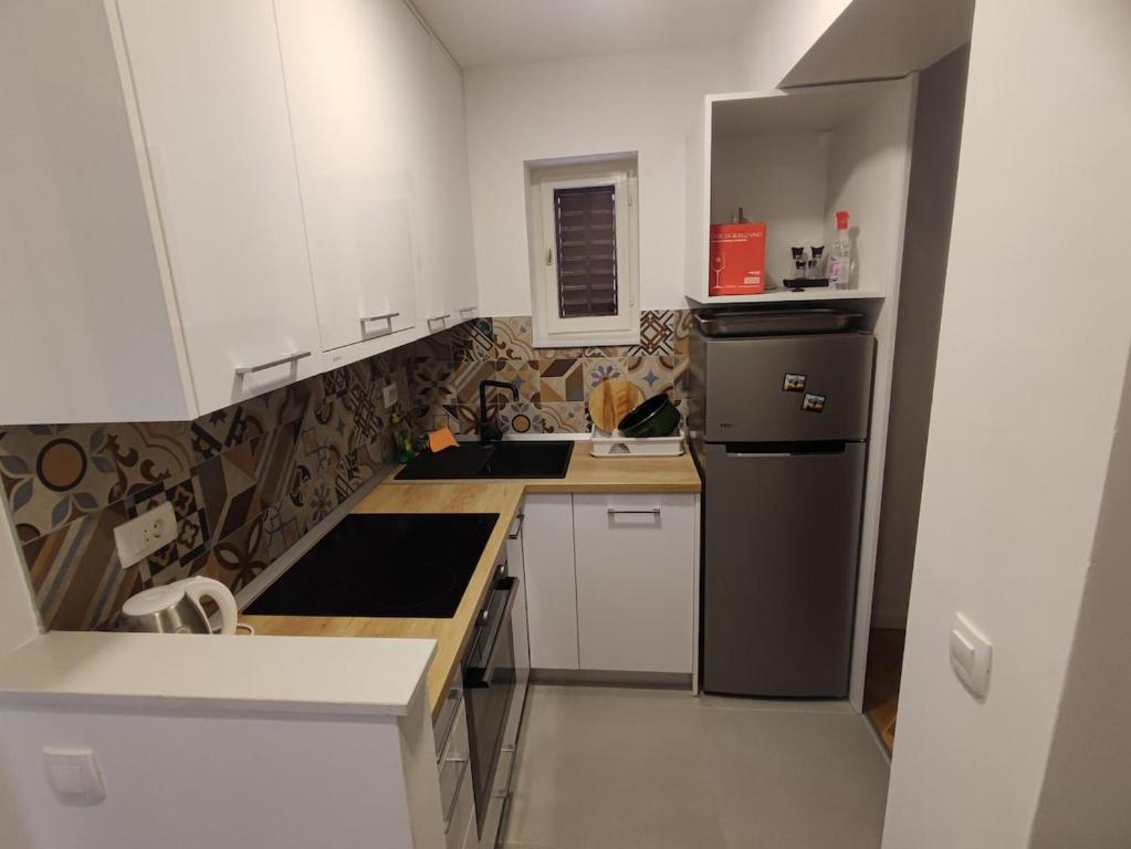 Kuchyň nebo kuchyňský kout v ubytování Apartments Šarić