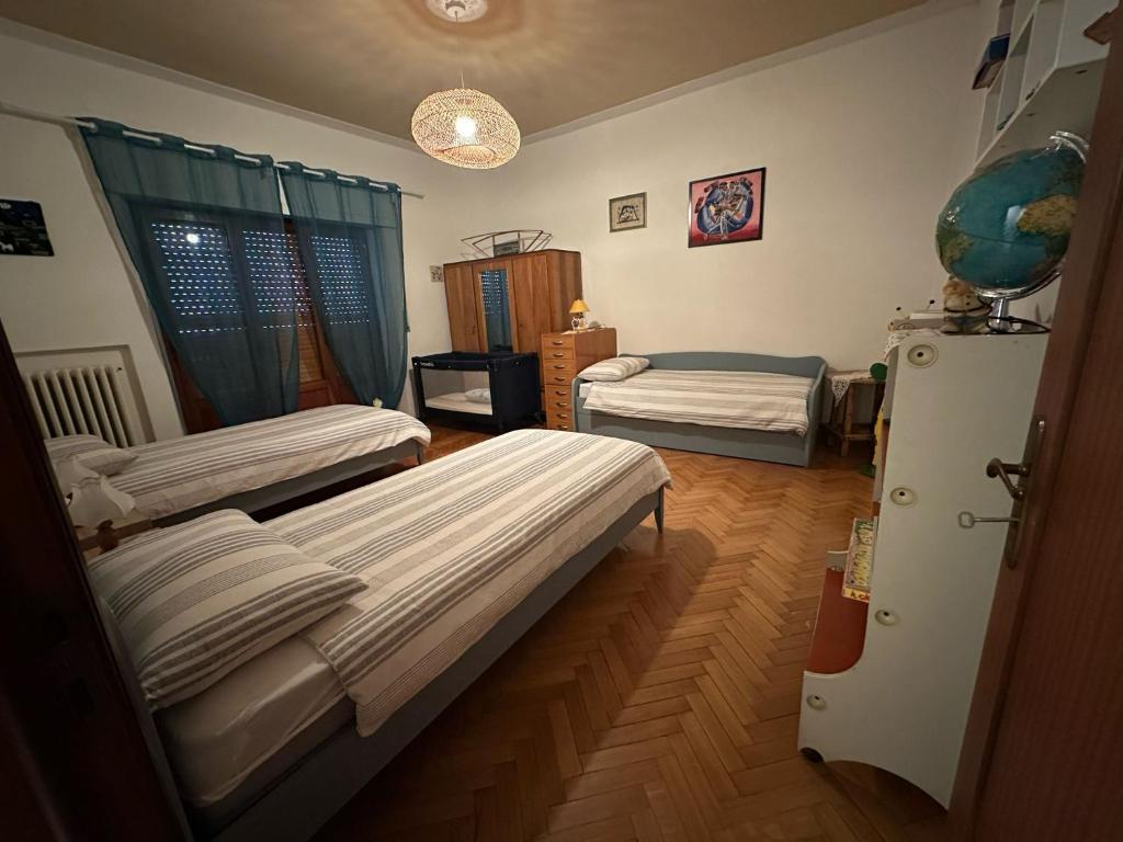 Postel nebo postele na pokoji v ubytování Villetta la Fortezza