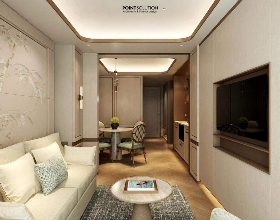 ホーチミン・シティにあるLa Passion Saigon Hotelのソファとテーブルのあるリビングルーム