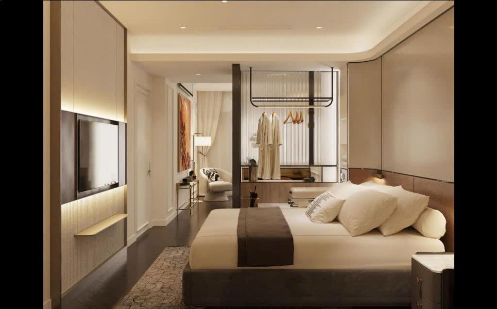 La Passion Saigon Hotelにあるベッド