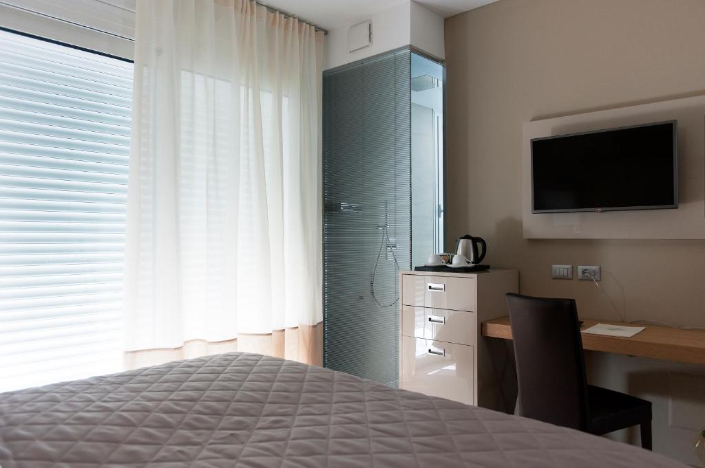 Postel nebo postele na pokoji v ubytování Hotel Le Soleil