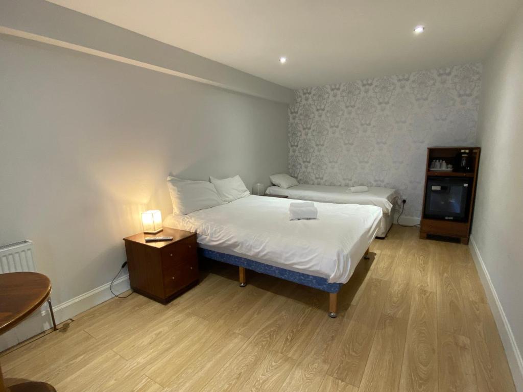 Postel nebo postele na pokoji v ubytování Park View Rooms