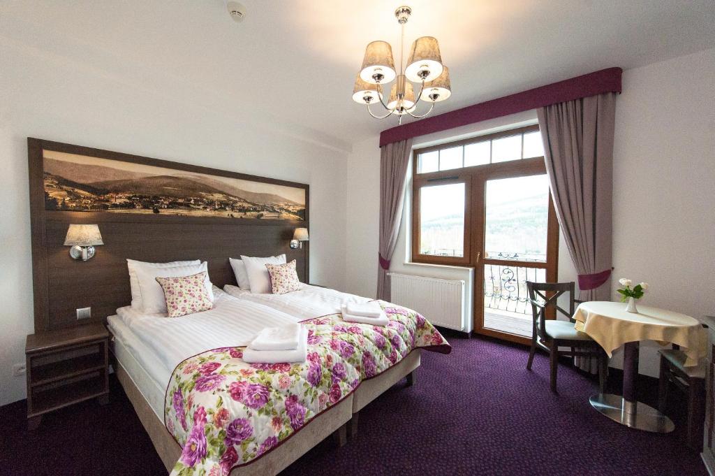 Posteľ alebo postele v izbe v ubytovaní Hotel Buczyński Medical & SPA