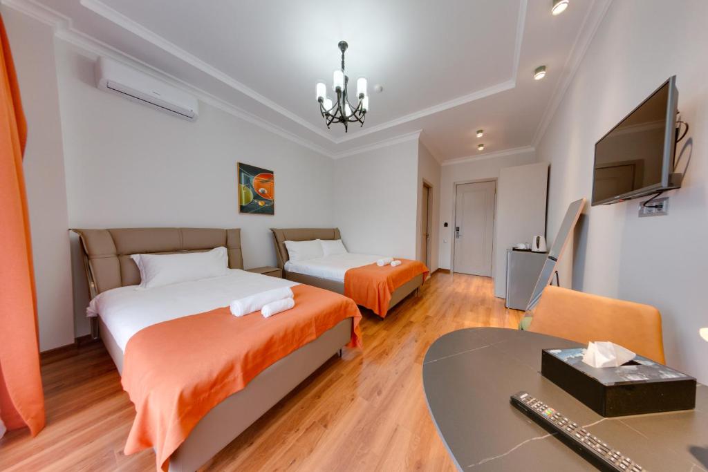 Postel nebo postele na pokoji v ubytování Sun Wine Hotel