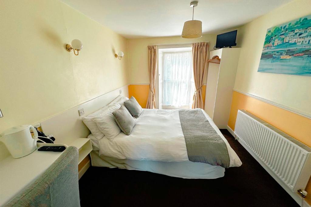 Postel nebo postele na pokoji v ubytování Woodstock Arms - Bar, Bed & Breakfast