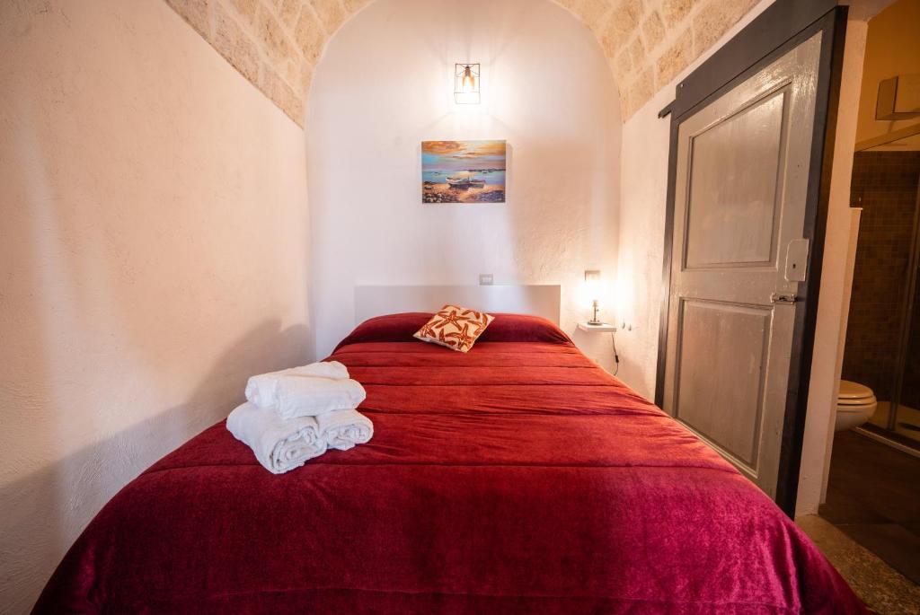 Postel nebo postele na pokoji v ubytování POLIGNANO BONITA
