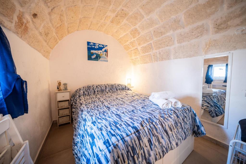 Postel nebo postele na pokoji v ubytování POLIGNANO BONITA