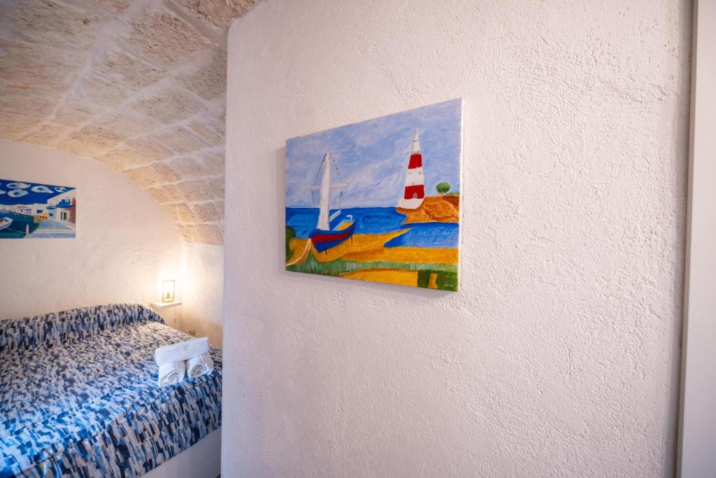 Postel nebo postele na pokoji v ubytování POLIGNANO BONITA