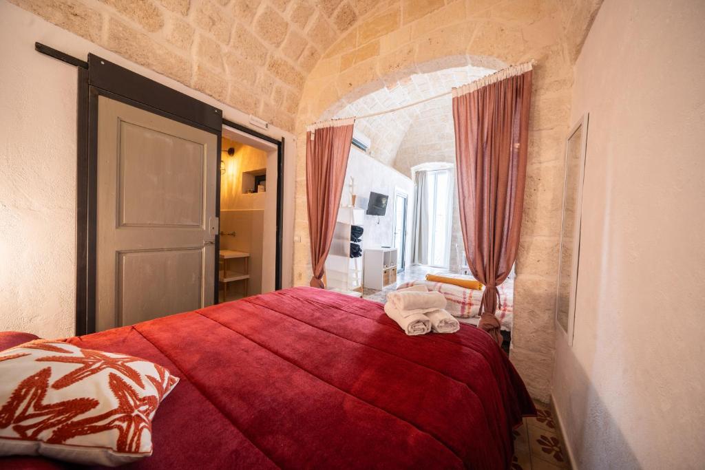 Postel nebo postele na pokoji v ubytování POLIGNANO BONITA