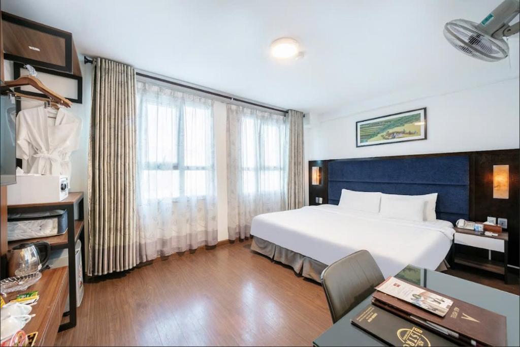 Postel nebo postele na pokoji v ubytování A25 Hotel - 28 Trần Quý Cáp
