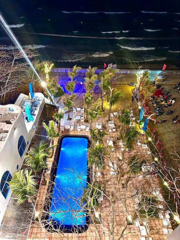 an overhead view of a swimming pool at a resort at KParis Beach Resort in Bình Sơn