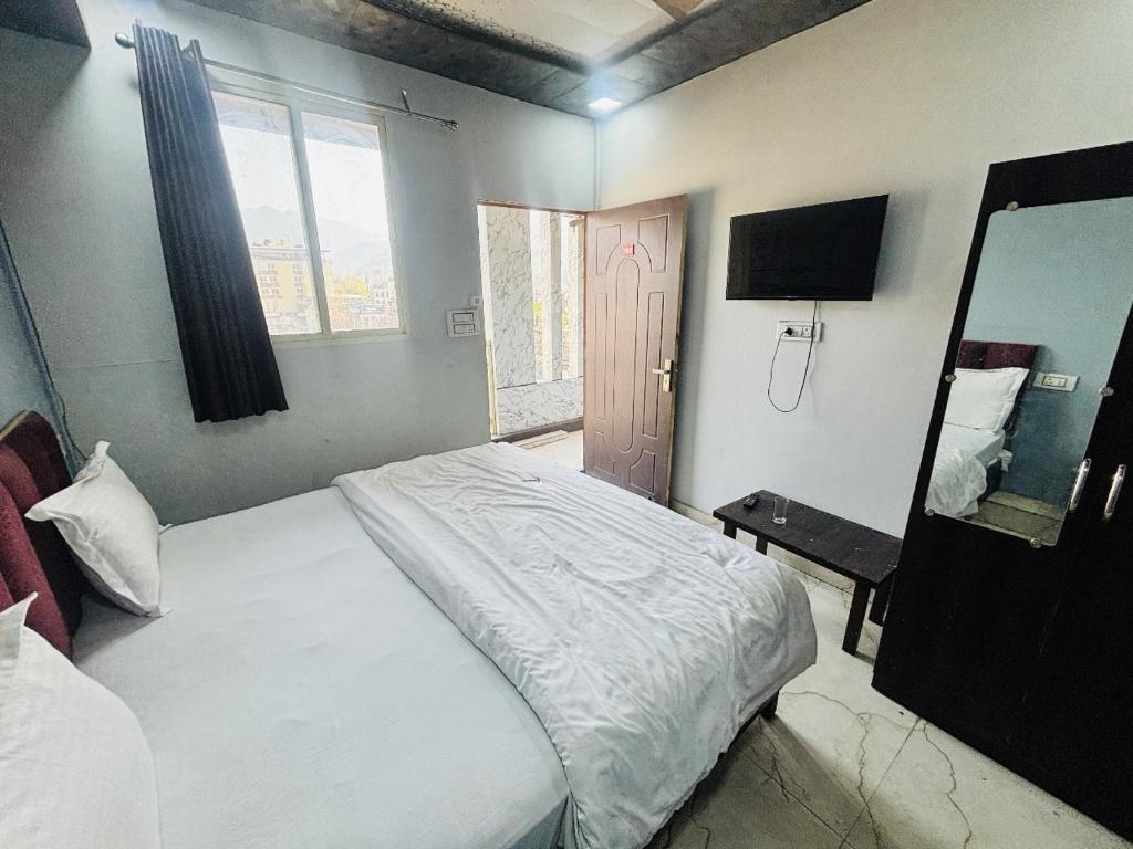 Postel nebo postele na pokoji v ubytování Dharohar Homestay Chandrabhaga