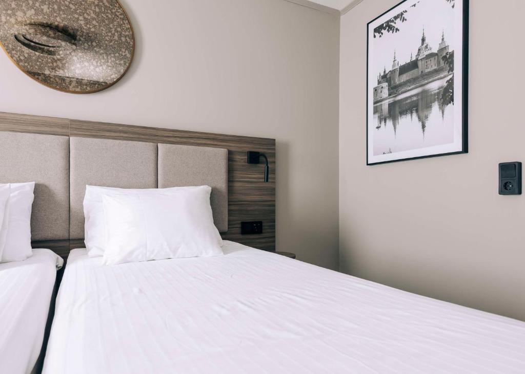 Postel nebo postele na pokoji v ubytování Best Western Plus Kalmarsund Hotell