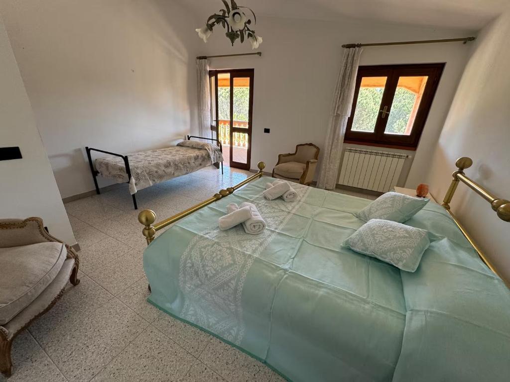 Postel nebo postele na pokoji v ubytování Casa Casteddina