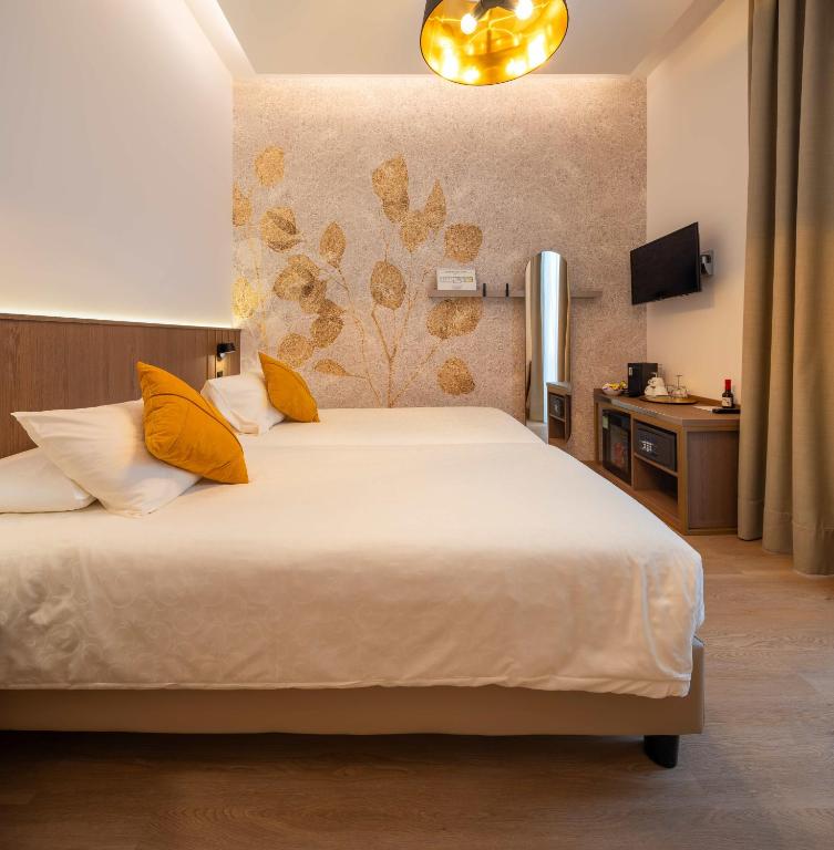 Voodi või voodid majutusasutuse Hotel Walter Au Lac toas