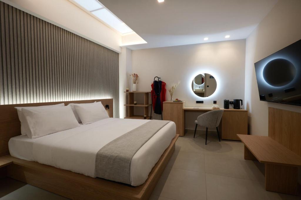 Postel nebo postele na pokoji v ubytování Athens City Suites