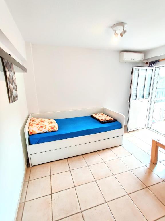 Postel nebo postele na pokoji v ubytování FLOGITA - 5 Beautiful Apartments