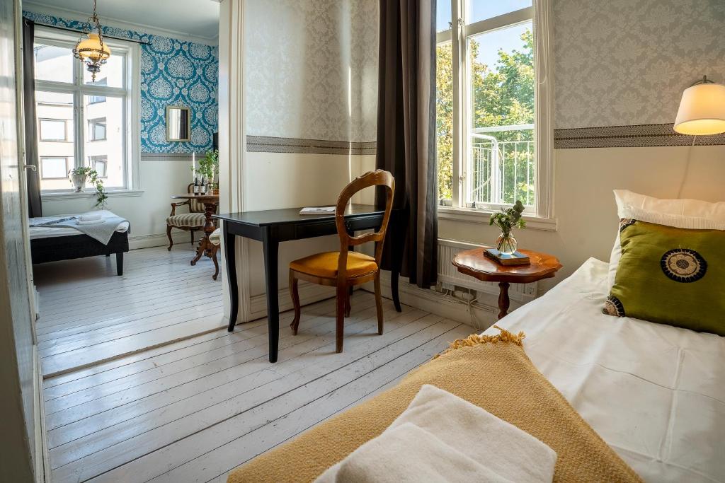 Postel nebo postele na pokoji v ubytování Grand Hotel Lysekil