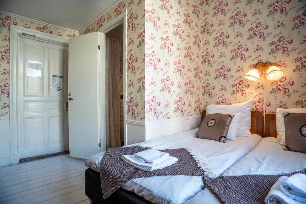 Postel nebo postele na pokoji v ubytování Grand Hotel Lysekil