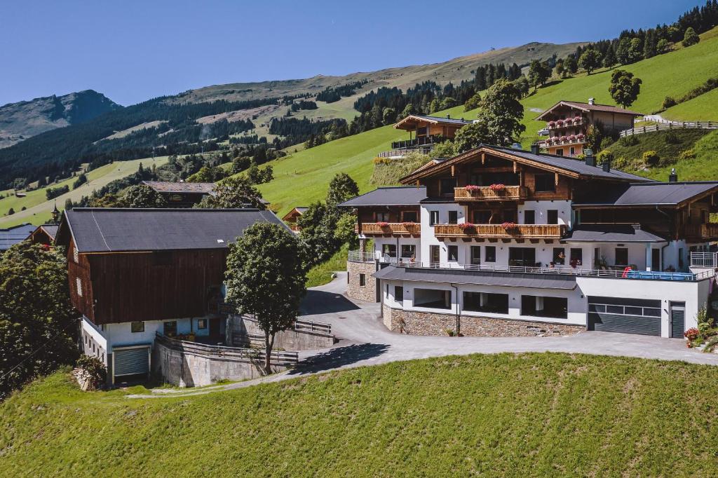 an aerial view of a large house on a hill at Lindlinghof in Saalbach-Hinterglemm