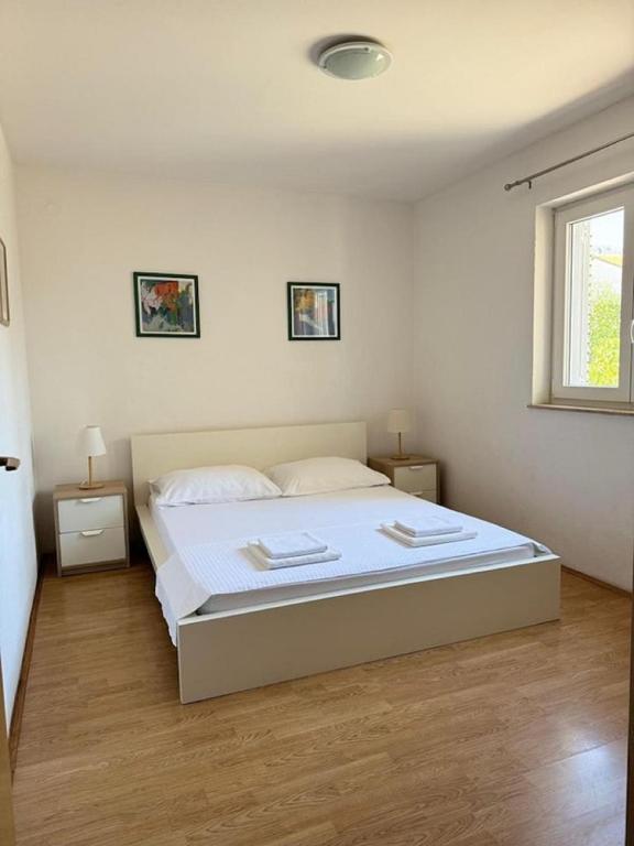 Postel nebo postele na pokoji v ubytování Apartments Marković