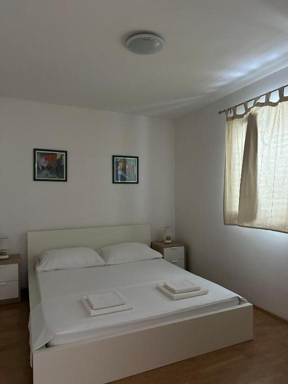 Postel nebo postele na pokoji v ubytování Apartments Marković