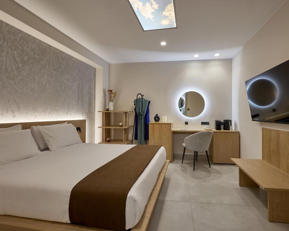 Postel nebo postele na pokoji v ubytování Athens City Suites