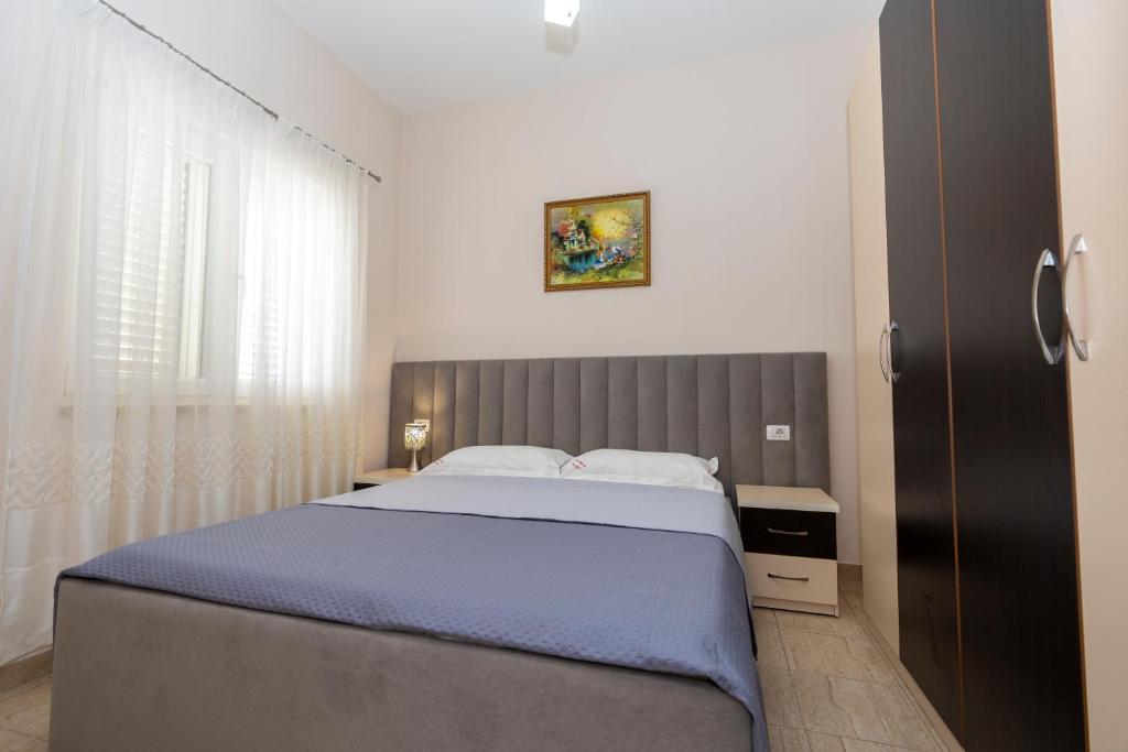 Postel nebo postele na pokoji v ubytování Hotel Albania
