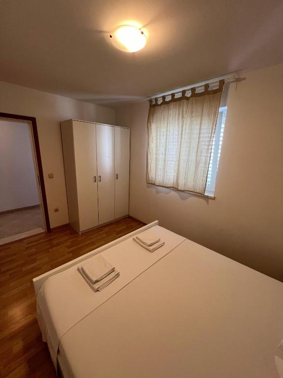 Postel nebo postele na pokoji v ubytování Apartments Marković