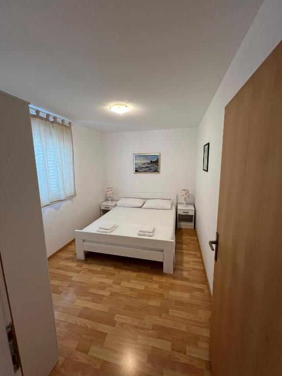 Postel nebo postele na pokoji v ubytování Apartments Marković