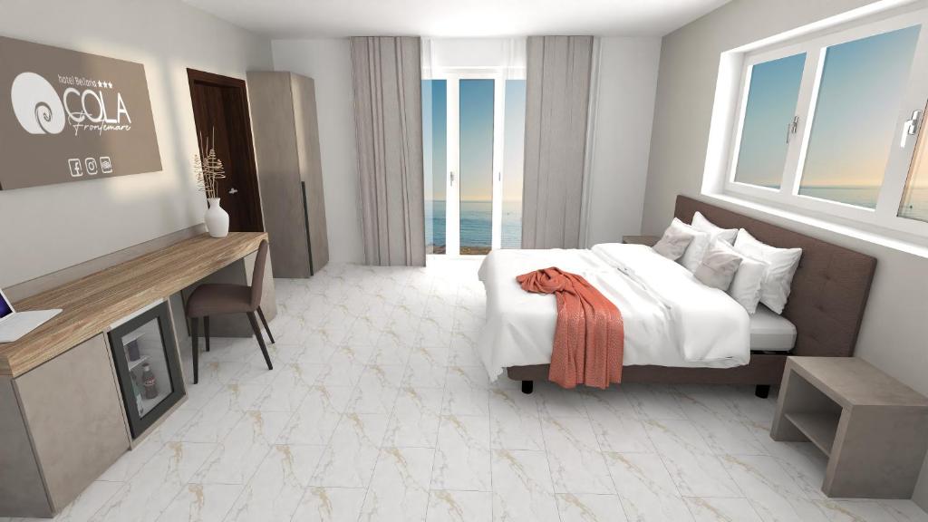 Postel nebo postele na pokoji v ubytování Hotel Cola Frontemare