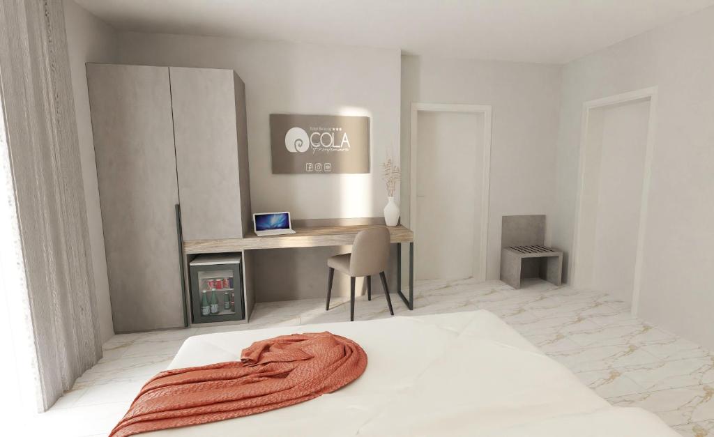 Postel nebo postele na pokoji v ubytování Hotel Cola Frontemare
