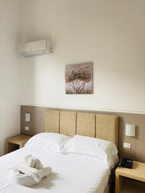 A bed or beds in a room at Hotel Virginia