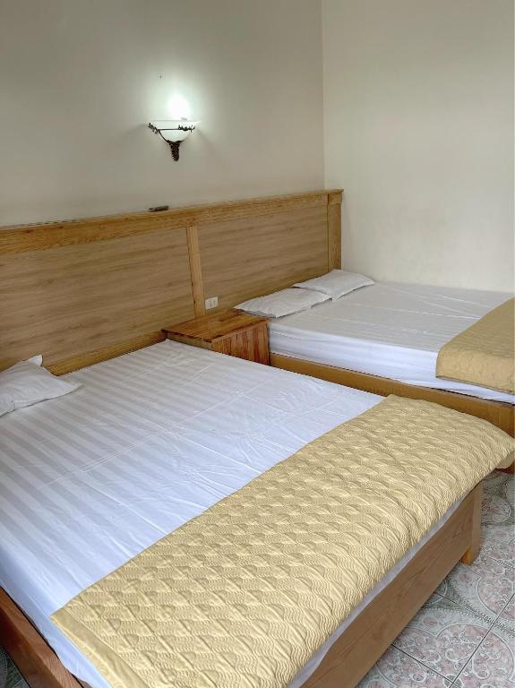 Postel nebo postele na pokoji v ubytování Hà Hương