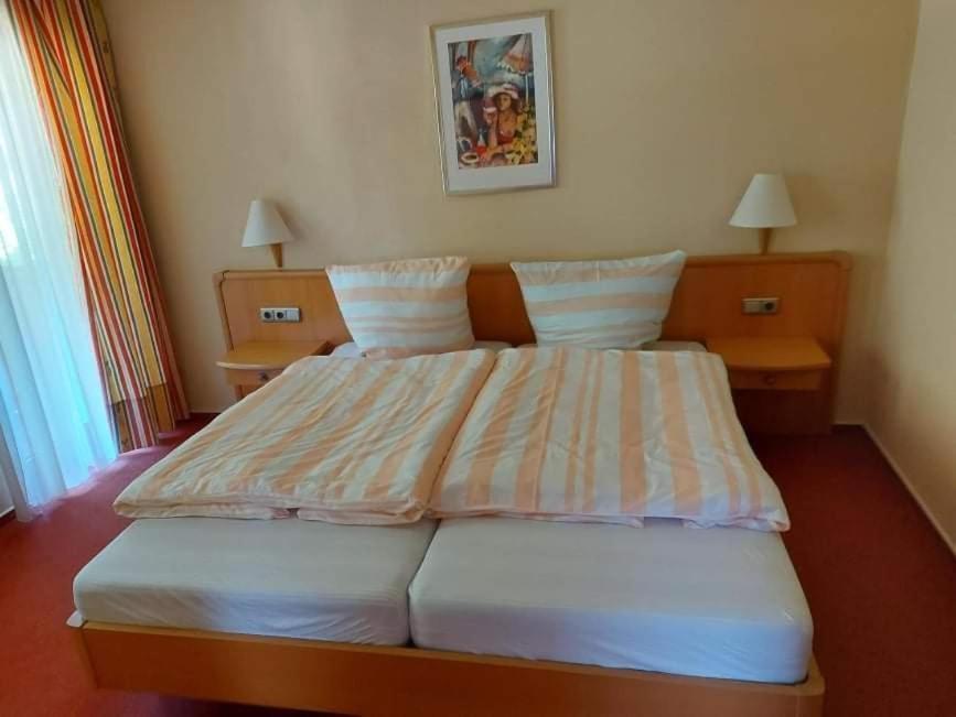 Postel nebo postele na pokoji v ubytování Sparta Hotel