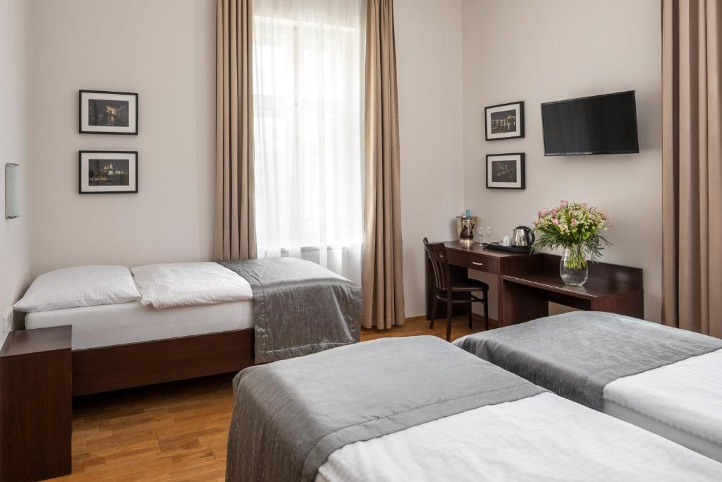 Postel nebo postele na pokoji v ubytování Hotel Unique