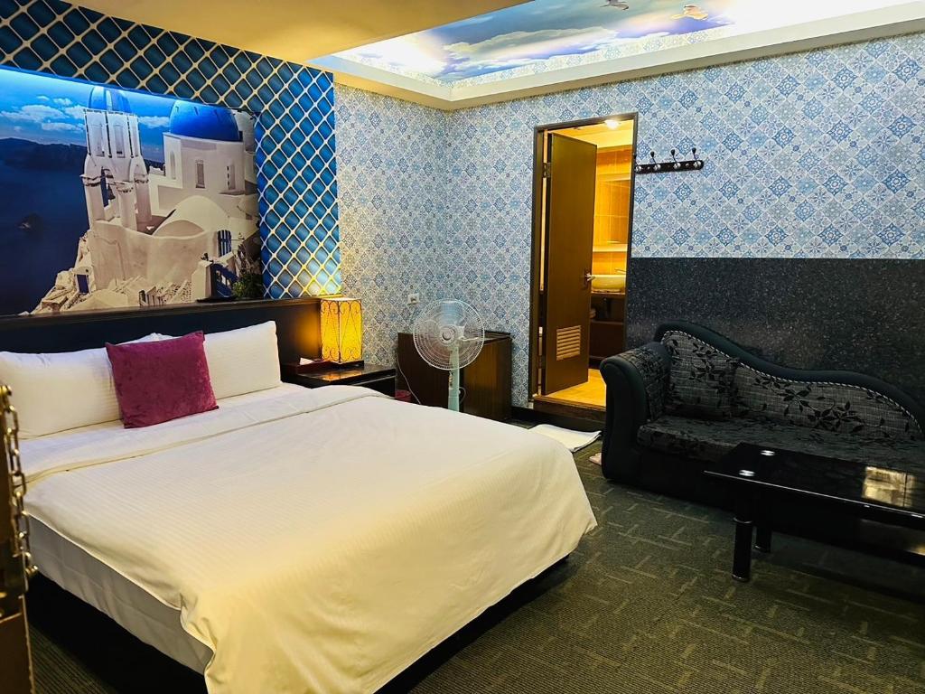 Postel nebo postele na pokoji v ubytování Wecity Hotel 薇城精緻旅店