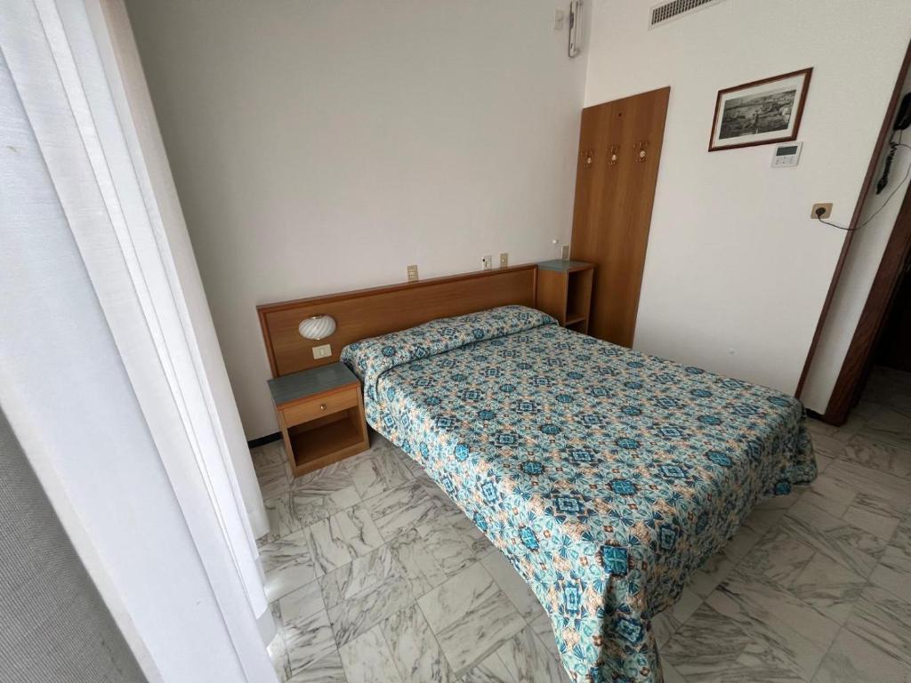 Postel nebo postele na pokoji v ubytování Hotel Valentino