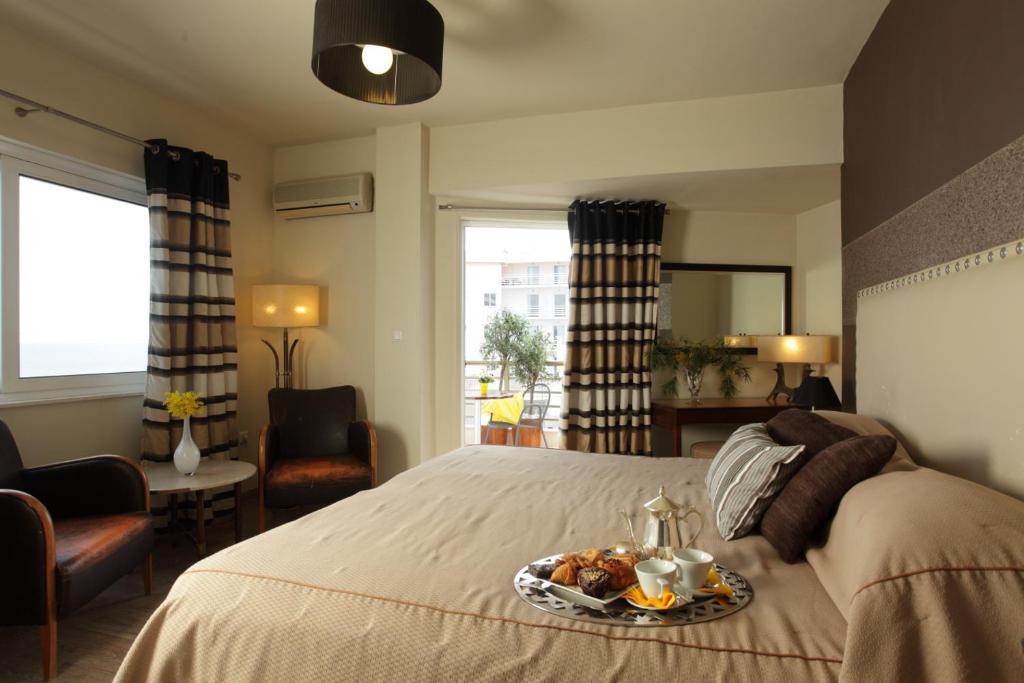 Postel nebo postele na pokoji v ubytování Mati Hotel