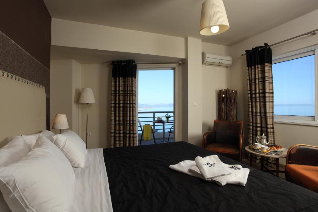Postel nebo postele na pokoji v ubytování Mati Hotel
