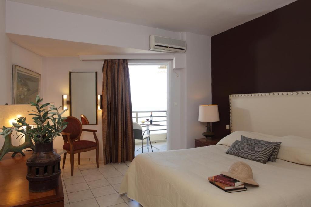Postel nebo postele na pokoji v ubytování Mati Hotel