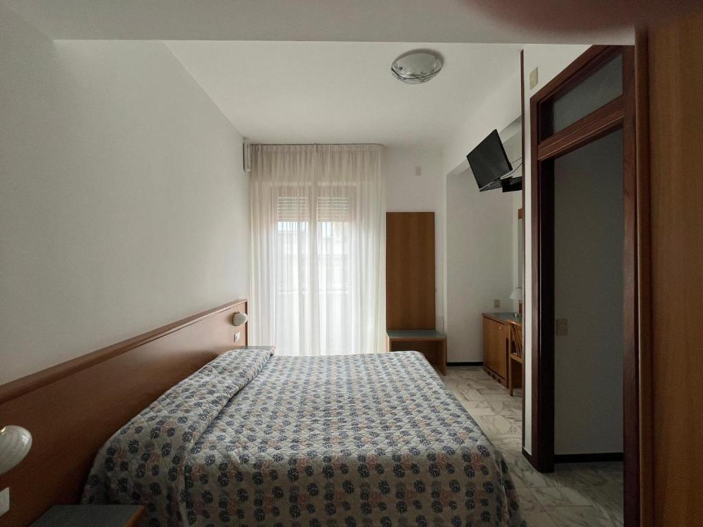 Postel nebo postele na pokoji v ubytování Hotel Valentino
