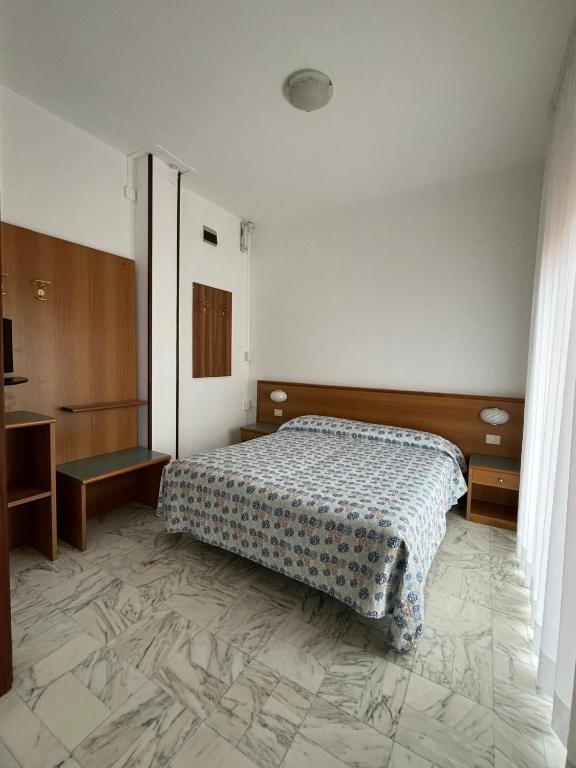 Postel nebo postele na pokoji v ubytování Hotel Valentino