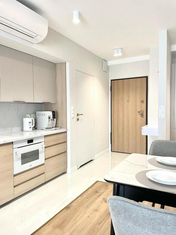 Kuchyň nebo kuchyňský kout v ubytování Solaris Darłówko Premium Emilia Strupiechowska