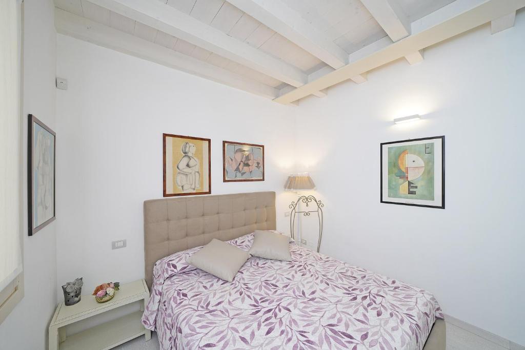 Posteľ alebo postele v izbe v ubytovaní Resort Caesar C4 Sirmione - Gardagate