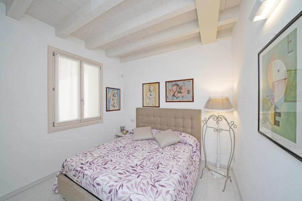 Posteľ alebo postele v izbe v ubytovaní Resort Caesar C4 Sirmione - Gardagate