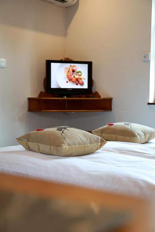 Postel nebo postele na pokoji v ubytování Hotel - Restaurant Le Cerf & Spa