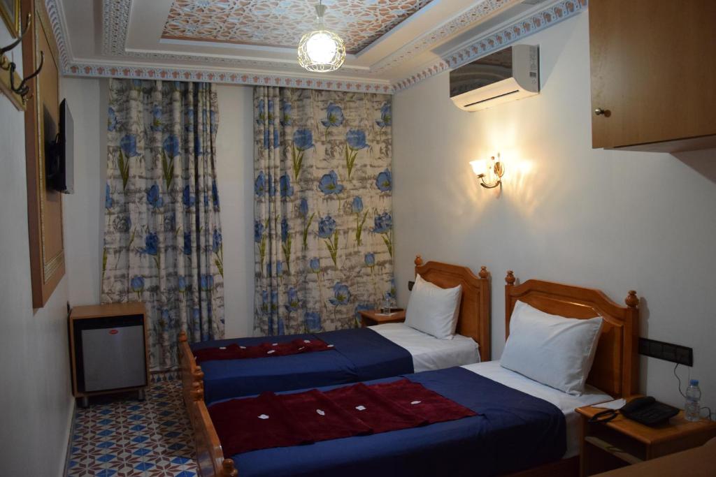 Postel nebo postele na pokoji v ubytování Diyafat Bladi