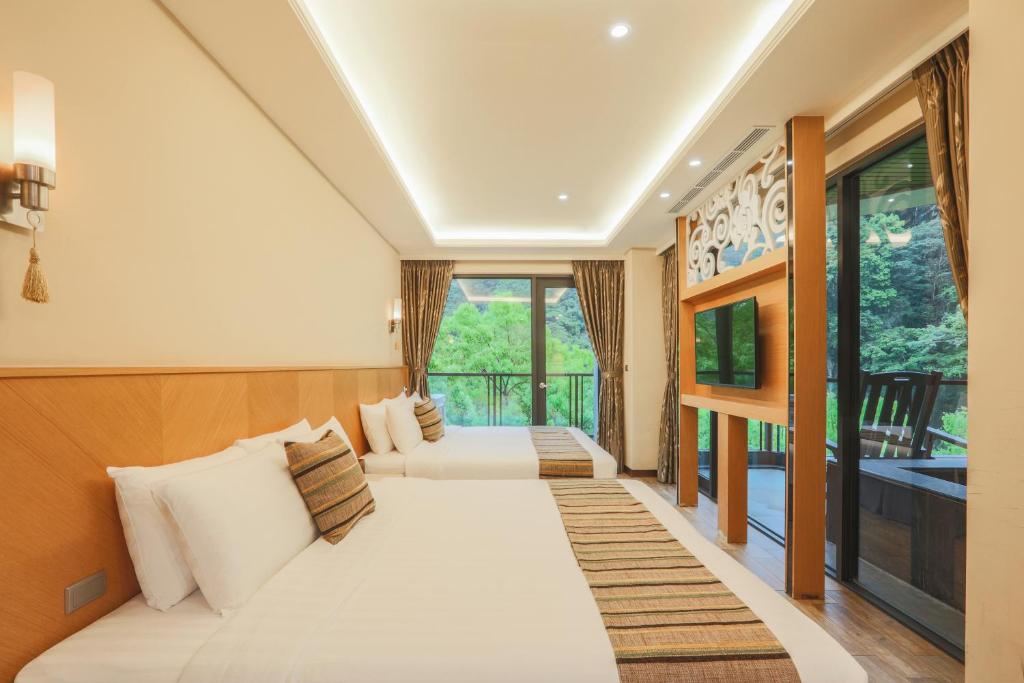 Postel nebo postele na pokoji v ubytování 日出溫泉飯店Sunrise Hot Spring Hotel